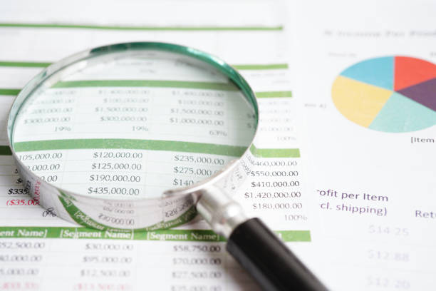 istock Magnifying glass on charts graphs paper. Financial development, Banking Account, Statistics, Investment Analytic research data economy. 1480607173