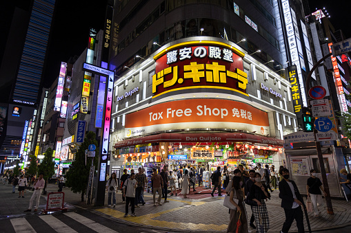 Tokyo, Japan - September 1, 2022 : Pedestrians walk past the Don Quijote Store in Shinjuku, Tokyo, Japan. It is a famous Japanese discount store chain.