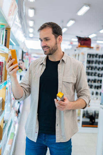 istock A Young man is Choosing Clothes in a Supermarket Store 1480607625