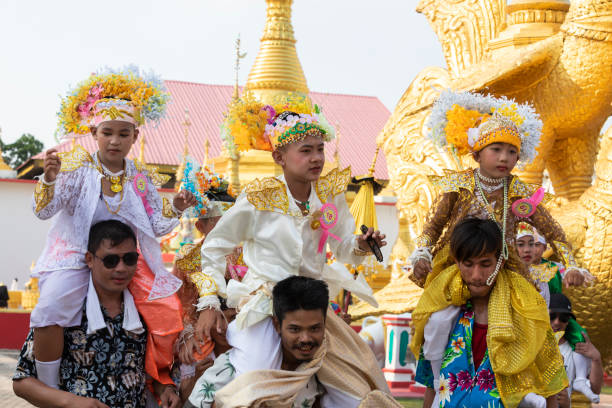 Mae Sot, Tak, Thailand - April 04, 2023 : The parade of Poy Sang Long dancing around the temple Wat Thai Wattanaram, Mae Sot, Tak, Thailand.