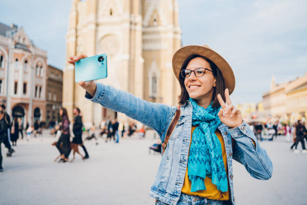 istock Young female tourist makes selfies 1480608806