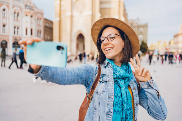 istock Young female tourist makes selfies 1480608851