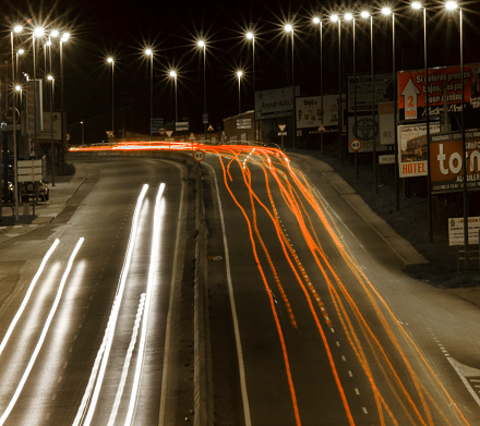 Highway at night, multiple lane, high angle view, row of street lights glowing. Galicia, Spain.