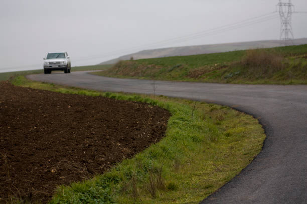 Mountain road, four-wheel driving, mountain landscape . Country road in winter time. Dangerous driving, Galicia, Spain.