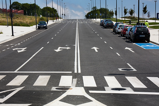 Straight road, empty lanes, zebra crossing. Lugo province, Galicia, Spain