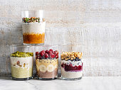 Overnight oats, Bircher muesli with fresh berries and fruits in a glass jars. Healthy diet breakfast. Overnight oatmeal with Fruit. Breakfast with overnight oatmeal