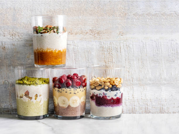 Overnight oats, Bircher muesli with fresh berries and fruits in a glass jars. Healthy diet breakfast. Overnight oatmeal with Fruit. Breakfast with overnight oatmeal stock photo