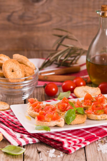 istock Friselle with cherry tomatoes and basil. 1480617746