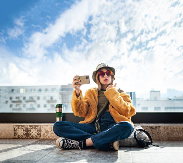 istock Vlogger girl looking at mobile make video call, shooting vlog 1480623815