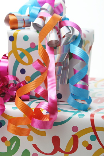 Wrapped gifts multi-colored presents ribbons of red, green, orange, pink