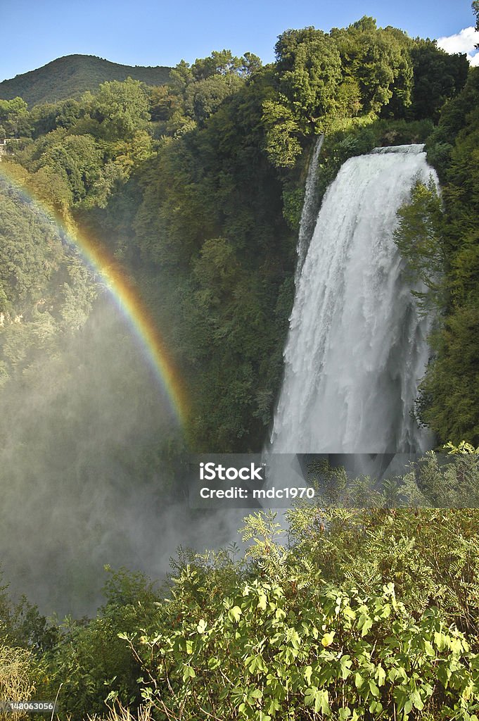 waterfall Marmore - Italy the first jump of the waterfall Marmore with rainbow, Umbria - Italy Forest Stock Photo