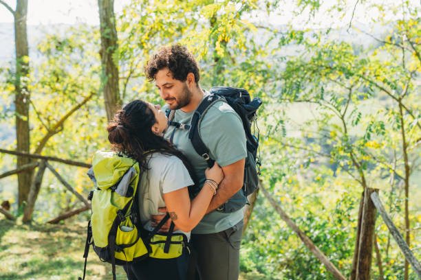 istock A couple is embracing together in the forest while they are taking a break from the hike 1480630716