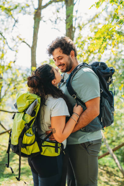 istock A couple is embracing together in the forest while they are taking a break from the hike 1480630724
