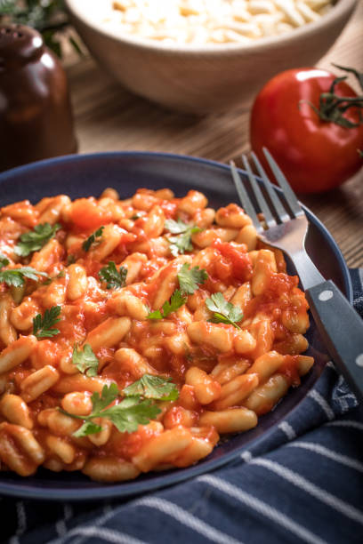 istock Cavatelli pasta with fresh tomato sauce. 1480634361