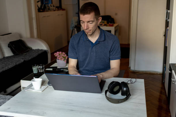 istock Mid aged male doing business from home 1480636758