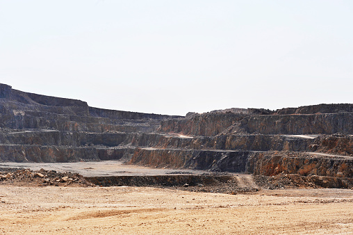 Lanark County, Canada - September 2, 2012: A pickup truck drives through Tatlock Quarry in Lanark County, Ontario. This open pit mine is the largest calcium-carbonate quarry in Canada.