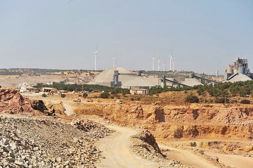 New and old technology. Clean and dirty energy. Mining quarry
