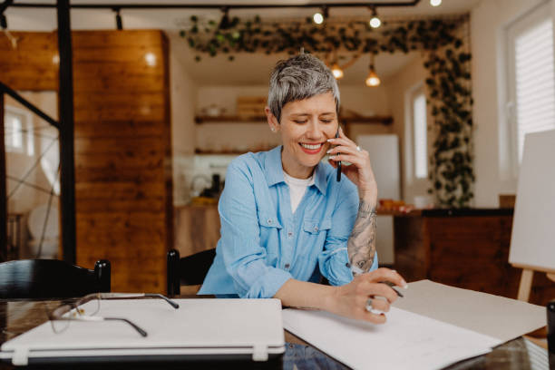 istock Senior woman talking over phone 1480642636
