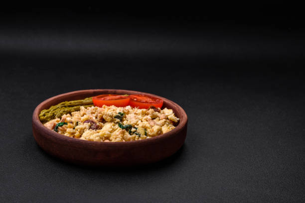 istock Delicious scramble with salmon, sun-dried tomatoes, spinach, spices and herbs 1480643874