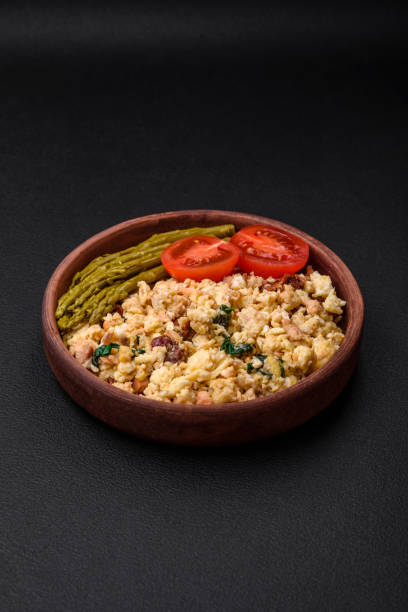 istock Delicious scramble with salmon, sun-dried tomatoes, spinach, spices and herbs 1480643877