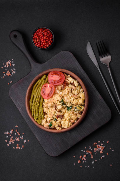 istock Delicious scramble with salmon, sun-dried tomatoes, spinach, spices and herbs 1480643898