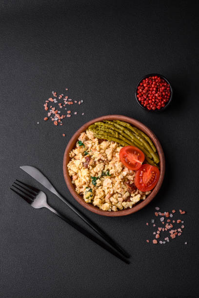 istock Delicious scramble with salmon, sun-dried tomatoes, spinach, spices and herbs 1480643899