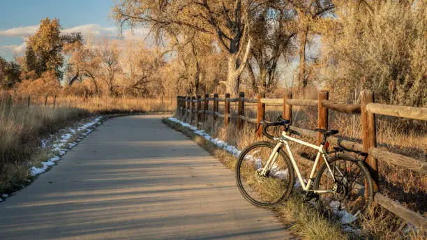 touring bike on a bike trail in late fall scenery - Poudre River Trail in northern Colorado
