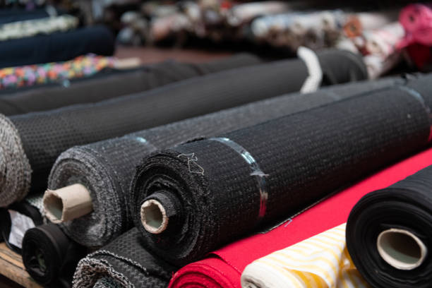 istock Interior of an industrial warehouse with fabric rolls samples. Small business textile colorful warehouse. 1480645450
