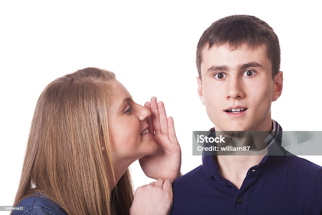 Girl Whispering something to his Friend Adolescence Stock Photo