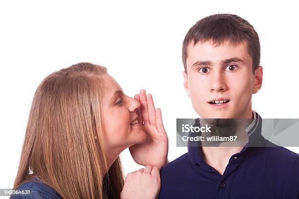 Girl Whispering Something To His Friend Stock Photo - Download Image Now - Adolescence, Adult, Advice