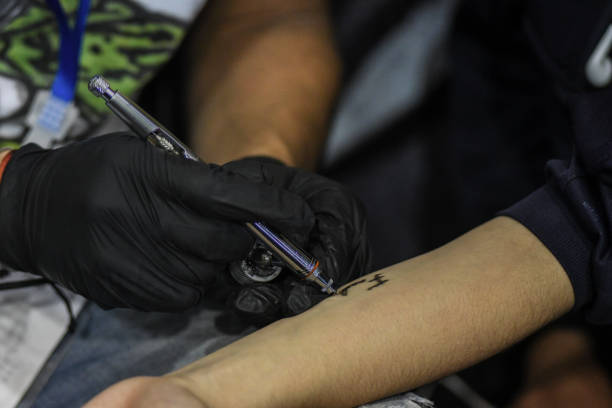 istock Tattoo artist with protective gloves 1480652987