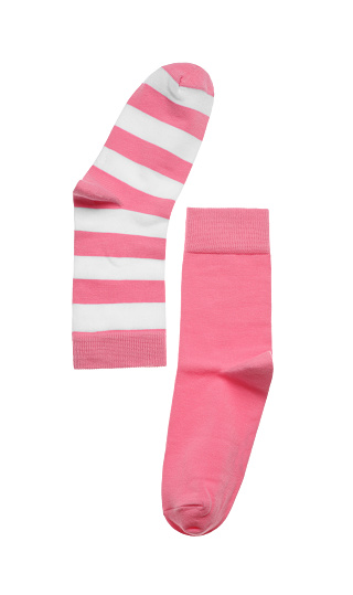 Different pink socks on white background, top view