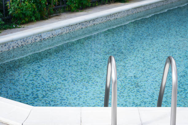 istock Ladder with grab bars in outdoor swimming pool 1480659409