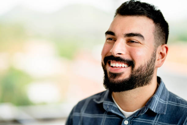 istock Young architect laughing while standing in a house under renovation 1480659569