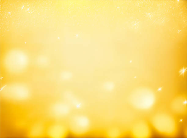 yellow abstract background with bokeh defocused lights stock photo