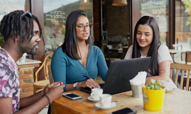 istock Young friends working on a laptop over cafe at a cafe 1480662301