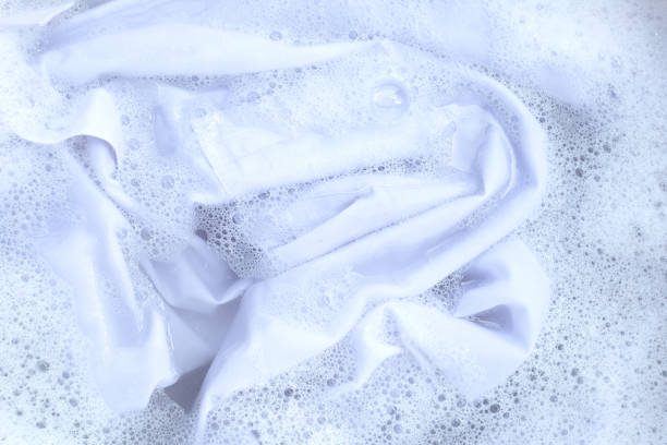 istock Top view of formal shirts soak in powder detergent water dissolution. Laundry concept 1480663278