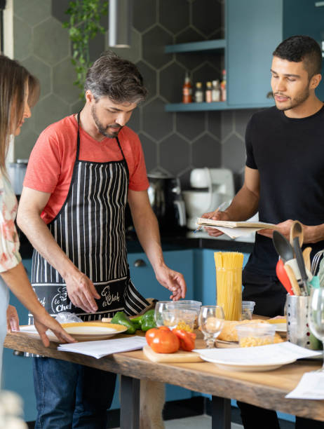 istock Adult students watching a teacher during a cooking class 1480663535