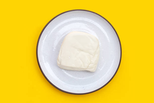 istock White tofu on yellow background 1480664653