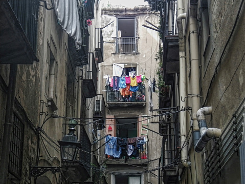 Hang drying laundry in a narrow street in Barcelona