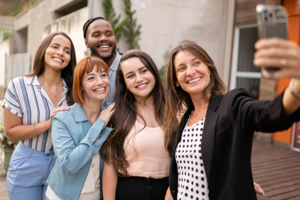istock Smiling friends taking a selfie together outside on a patio 1480667717