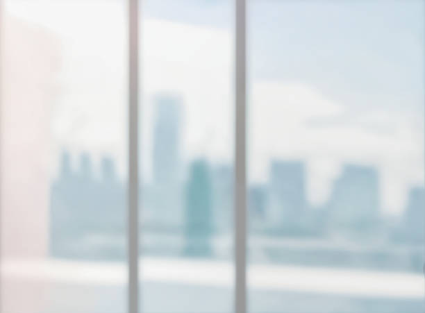 istock Blurred abstract glass wall from building in city town background. 1480668407