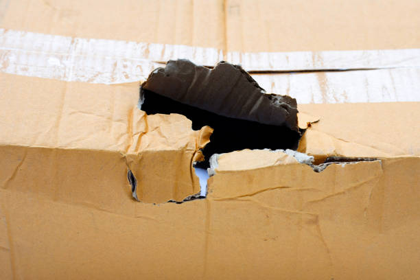 istock Damaged cardboard box. Close up 1480668816