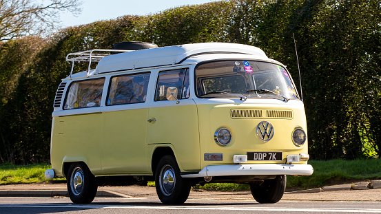 Bicester,Oxon, UK - April 7th 2023. 1972 VOLKSWAGEN  TRANSPORTER camper van travelling on an English country road