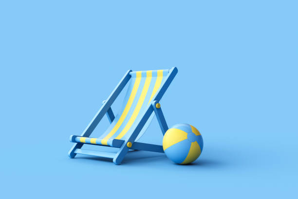 istock Striped deck chair and beach ball on blue background. 1480674090