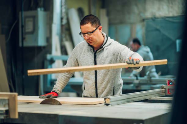 istock A craftsman is cutting wooden panel into small parts it his workshop. 1480677815