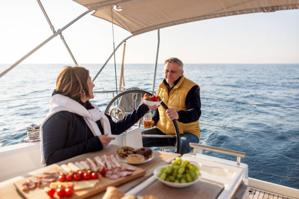 istock Joyful Married Couple Having A Dinner On The Sailing Boat 1480678043