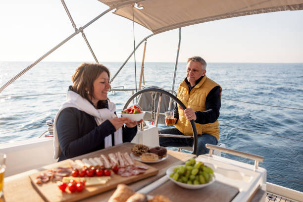 istock Joyful Married Couple Having A Dinner On The Sailing Boat 1480678045