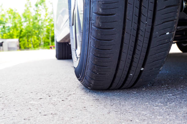 istock Car tire and drive travel image 1480680399