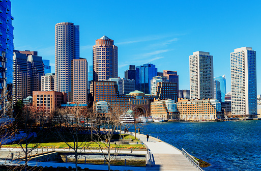View across the Seaport District's Fan Pier Park towards the downtown Boston waterfront skyline. The Seaport District is part of the larger neighborhood of South Boston, and is also sometimes called the Innovation District.